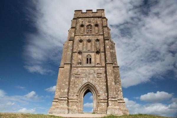 8548693-tourists-exploring-the-ruins-of-st-michael-s-tower-at-the-top-of-glastonbury-tor-in-somerest-england.jpg